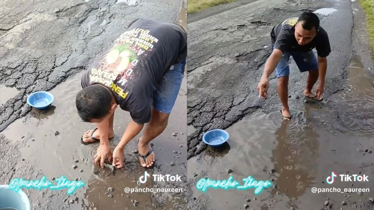 Lelaki tangkap ikan di jalan berlubang